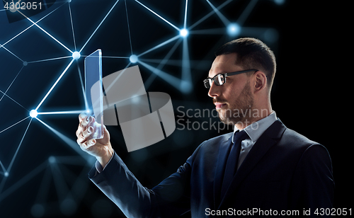 Image of businessman working with transparent tablet pc