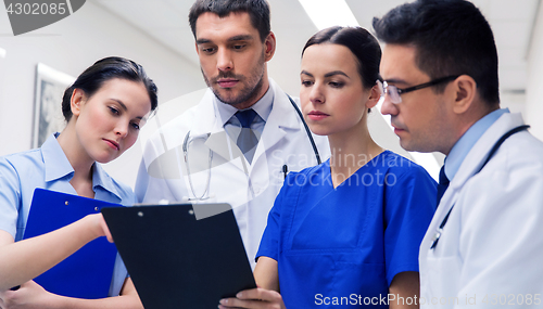 Image of group of medics with clipboards at hospital