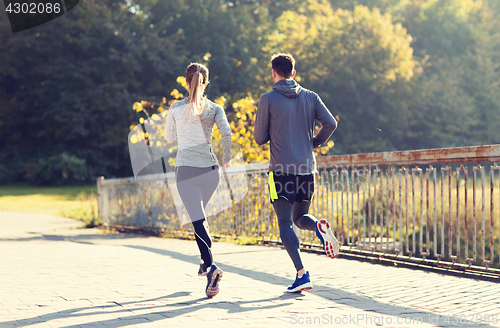 Image of couple running or jogging outdoors