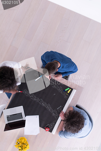 Image of top view of Multiethnic startup business team on meeting