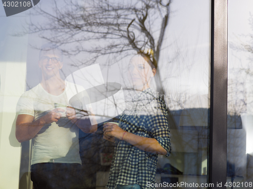 Image of young couple enjoying morning coffee