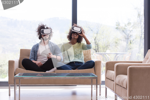 Image of Multiethnic Couple using virtual reality headset