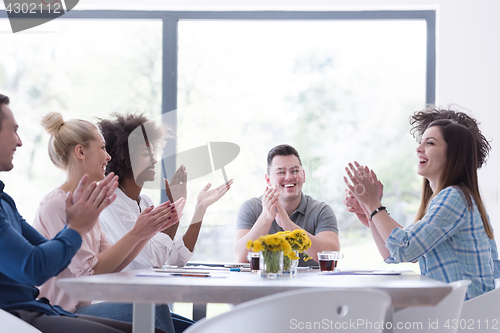 Image of multiethnic startup Group of young business people celebrating s