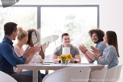 Image of multiethnic startup Group of young business people celebrating s