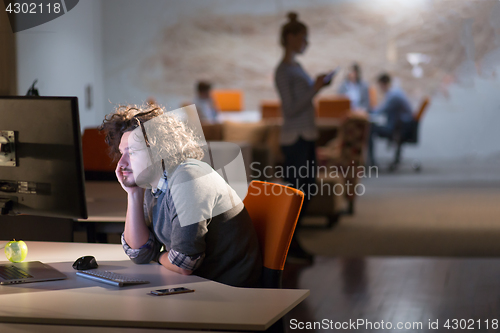 Image of businessman relaxing at the desk