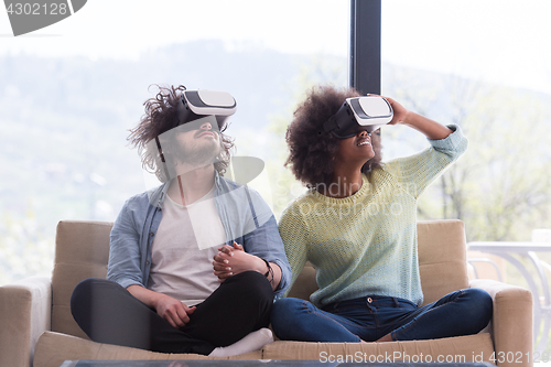 Image of Multiethnic Couple using virtual reality headset