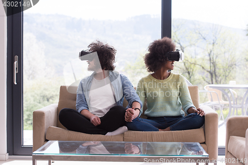 Image of Multiethnic Couple using virtual reality headset