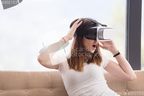 Image of woman using VR-headset glasses of virtual reality