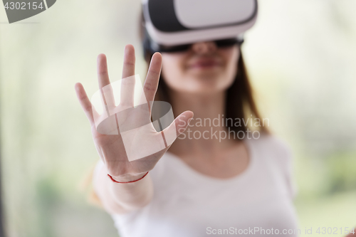 Image of woman using VR-headset glasses of virtual reality