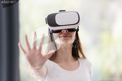 Image of woman using VR-headset glasses of virtual reality