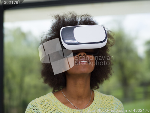 Image of black woman using VR headset glasses of virtual reality