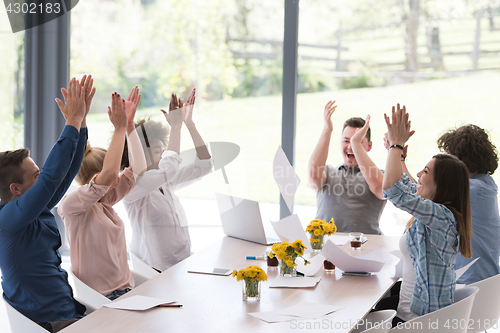 Image of multiethnic startup Group of young business people throwing docu