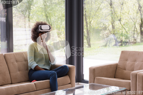 Image of black woman using VR headset glasses of virtual reality