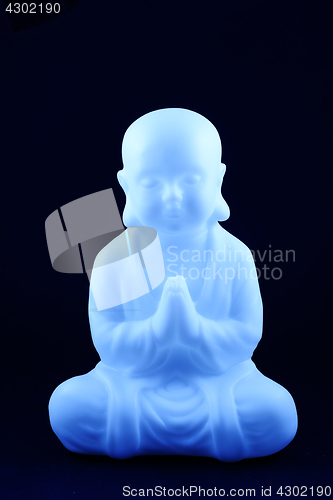 Image of plastic blue buddha sculpture