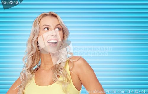 Image of happy smiling young woman with blonde hair