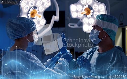 Image of surgeons in operating room at hospital