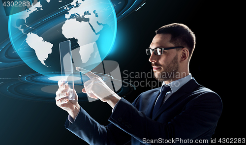 Image of businessman with tablet pc and virtual globe