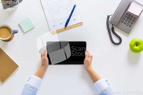 Image of hands of businesswoman with tablet pc at office