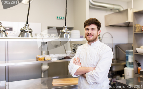 Image of happy male chef cook at restaurant kitchen