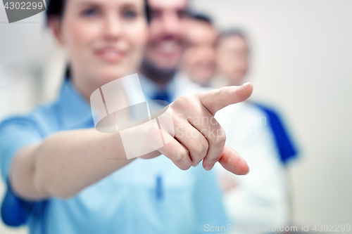 Image of close up of doctor pointing finger at hospital