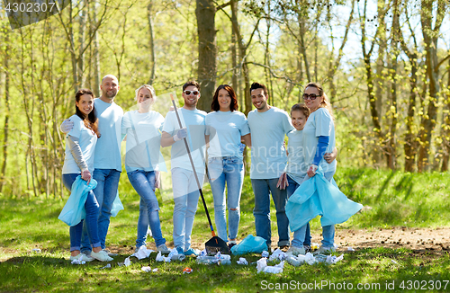 Image of group of volunteers with garbage bags in park