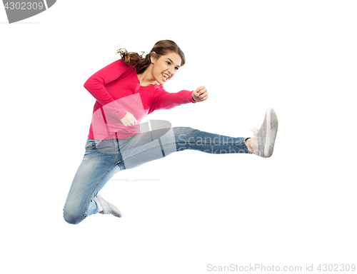 Image of smiling young woman jumping in air