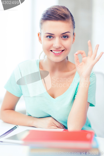 Image of smiling student girl with tablet pc