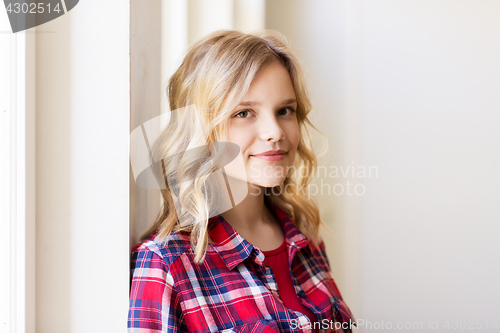 Image of portrait of smiling young woman or teenage girl