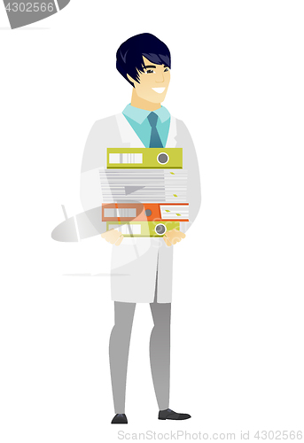 Image of Doctor holding pile of folders.