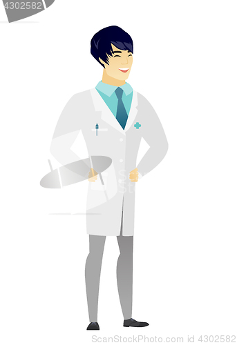 Image of Young asian doctor in medical gown laughing.