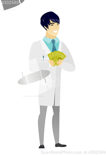 Image of Happy asian doctor holding money.