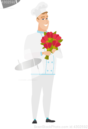 Image of Caucasian chef cook holding a bouquet of flowers.