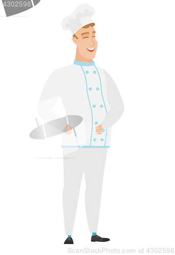 Image of Young caucasian chef cook laughing.