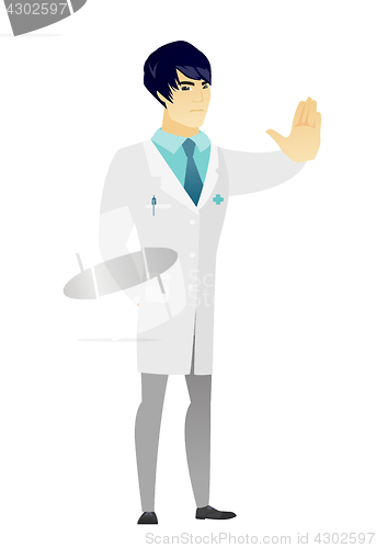 Image of Asian doctor showing stop hand gesture.