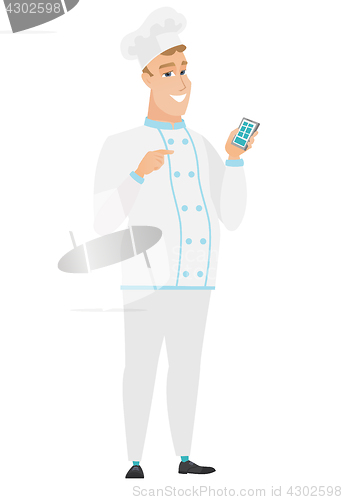 Image of Caucasian chef cook holding a mobile phone.