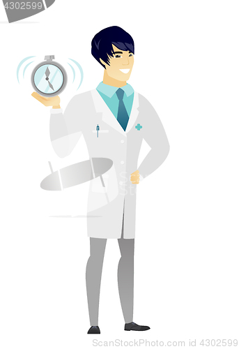 Image of Asian doctor holding alarm clock.