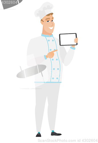 Image of Smiling chef cook holding tablet computer.