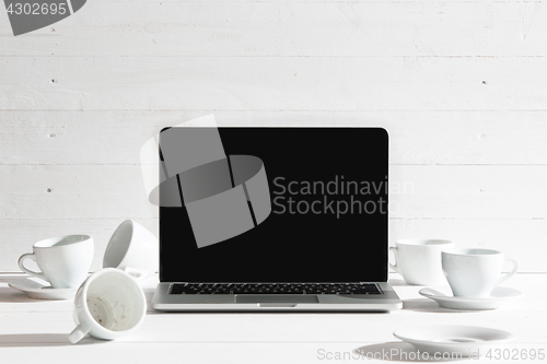 Image of The front view of notebook and cup of coffee. Inspiration and mock-up concept