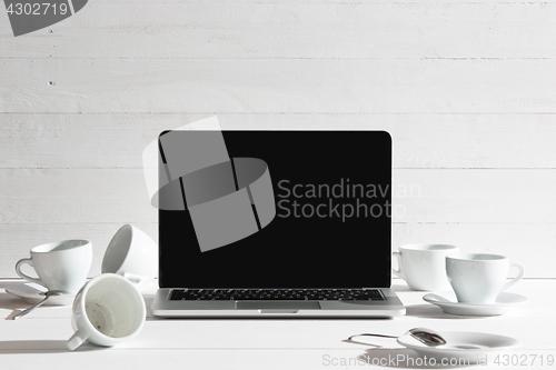 Image of The front view of notebook and cup of coffee. Inspiration and mock-up concept