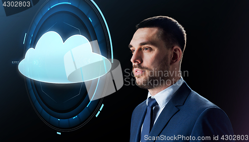 Image of businessman over black with cloud projection