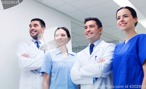 Image of group of happy medics or doctors at hospital