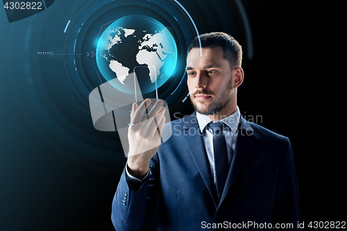 Image of businessman with smartphone and virtual globe