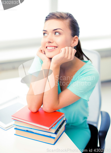 Image of happy smiling student girl with books