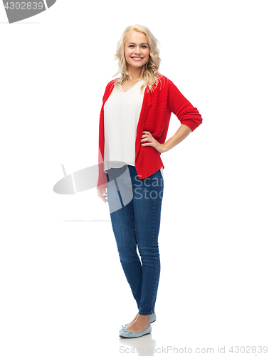 Image of happy smiling young woman in red cardigan