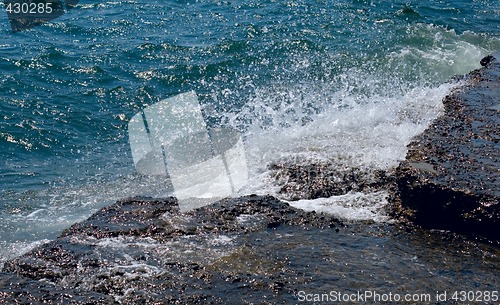 Image of stones and sea foam