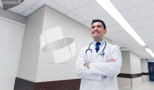 Image of smiling doctor in white coat at hospital