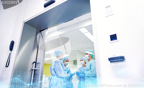 Image of group of surgeons in operating room at hospital