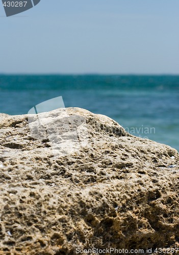 Image of rocky cliff and blue sea