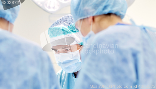 Image of group of surgeons in operating room at hospital