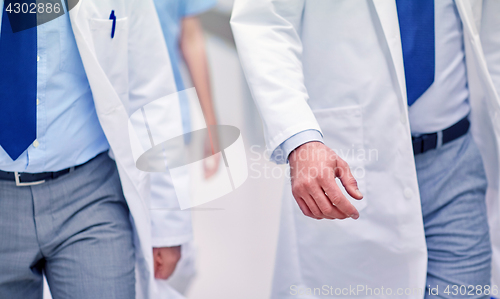 Image of close up of medics or doctors walking in hospital